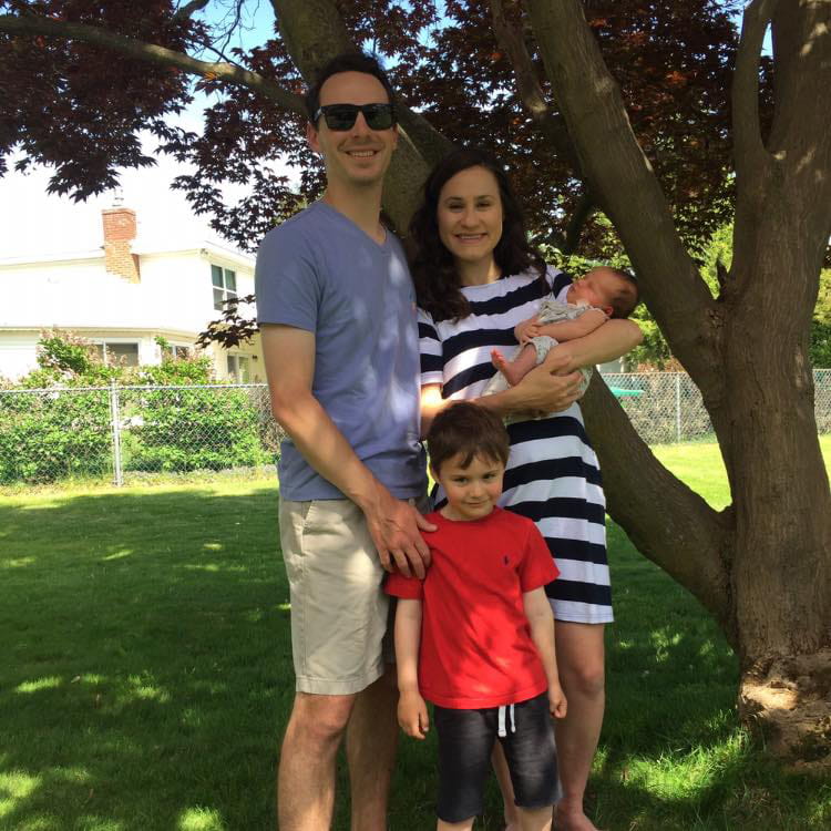 Family in front of tree